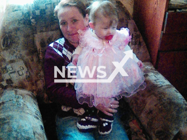 Lidia Shiryaeva, 49, poses together with her granddaughter in undated photo. She confessed to killing her daughter and her grandchildren by poisoning them in the village of Aleksandrovka, in Saratov, Russia on Dec. 13, 2021. Note: Picture is private (Lida Shiryaeva/Newsflash)