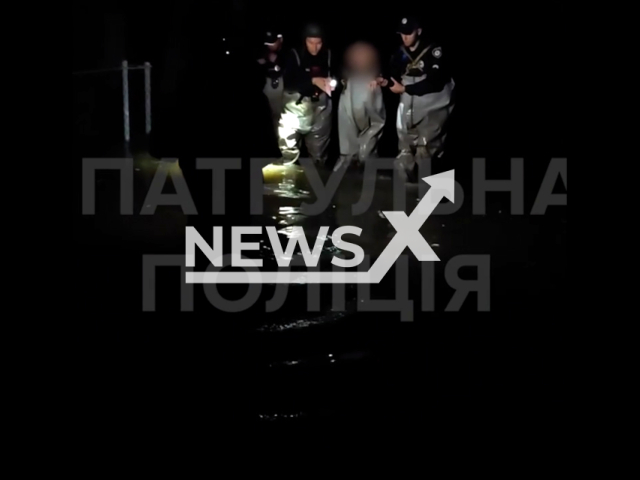 Police officers evacuate people and animals from the flooded areas in Kherson in Ukraine in undated footage. The footage was released by the Patrol police of the Kherson region on Wednesday, Jun. 7, 2023.
Notes: Photo is screen from a video. (@khersonpolice/Newsflash)