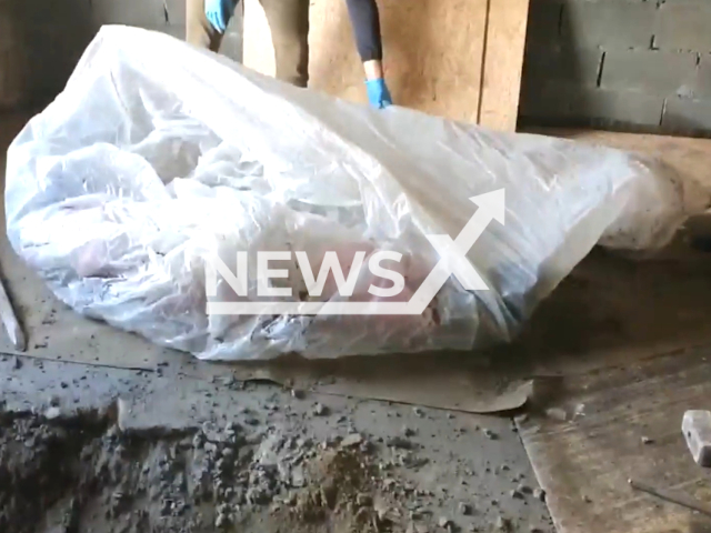 Police find the body of the construction worker in Yuzhno-Kurilsk, Sakhalin Oblast, Russia, undated. A builder allegedly killed his lazy partner for poor work. Note: Picture is a screenshot from a video (@sledcomsh/Newsflash)