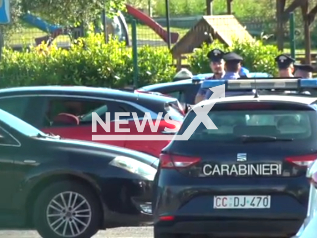 Police officers at the scene where a one-year-old girl was found dead in her mother's car in Rome, Italy, undated. She was forgotten by her father. Note: Image is a screenshot from video. (Newsflash)