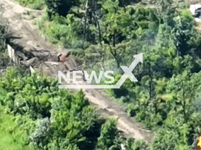 Russian soldiers flee in flame after the Ukrainian fighters destroy their tank in Ukraine in undated footage. The footage was released by the 110th separate mechanized brigade on Thursday, Jun. 8, 2023.
Notes: Photo is screen from a video. (@110separatebrigade/Newsflash)