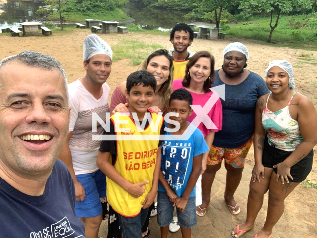 Jesus Cristian de Oliveira Rodrigues, 15, (third from the left) poses with unidentified people in undated photo. He drowned after saving a friend who was being carried away by the current, in Praia do Maroba, Brazil, on Sunday, May 28, 2023.
 Note: Private photo.  (@evair.vieirademelo/Newsflash)