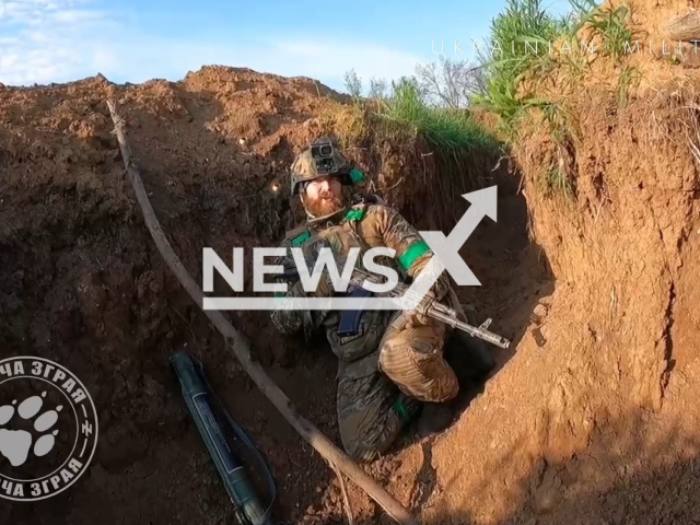 Picture shows Ukrainian soldier with a gun in trench in Ukraine in undated footage. The footage was released by the Ukrainian unit "Wolf Pack" of the 3rd separate assault brigade on Sunday, June 11, 2023. Note: Picture is a screenshot from a video (@wolfspackgroup/Newsflash)