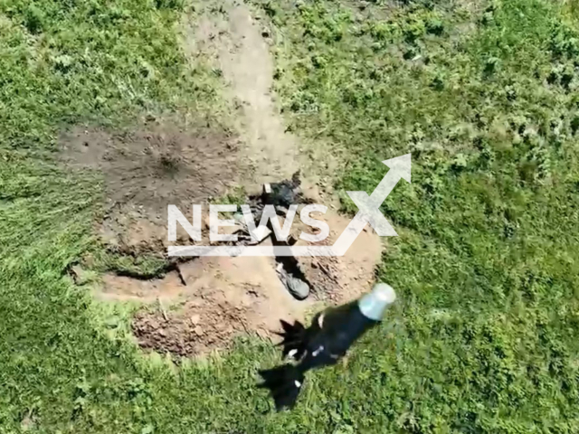 Ukrainian drones drops bombs on Russian foxhole in Bakhmut direction, Ukraine in undated footage. The footage was released by the 3rd separate assault brigade on Tuesday, June 13, 2023. Note: Picture is a screenshot from a video (@ab3army/Newsflash)