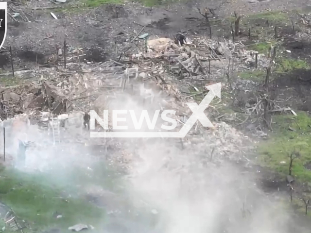 Russian soldiers move on destroyed residential building in Maryinka direction of Ukraine in undated footage. The footage was released by SOLOVEY air reconnaissance group of Poltava Separate Territorial Defense Brigade on Tuesday, June 13, 2023. Note: Picture is a screenshot from a video (@SOLOVEY144/Newsflash)