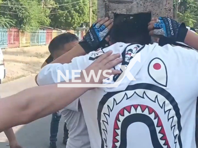 Rescuers take out the head of teenage cyclist, 14, from a pole in Olmaliq, Uzbekistan on Friday, June 9, 2023. He lost control of bicycle, hit a concrete electric fence and got his head stuck in it. Note: Picture is a screenshot from a video (@MCHSUzbek/Newsflash)