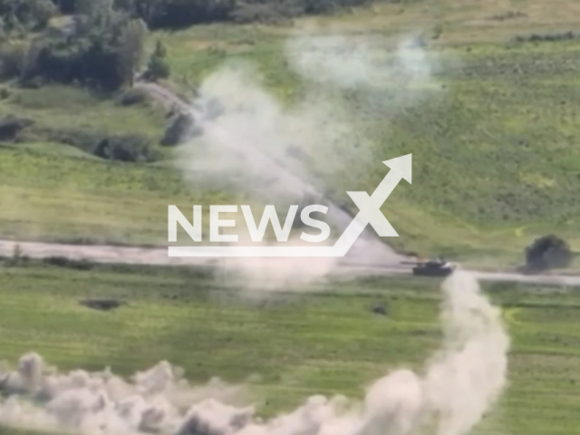 Ukrainian tank moves through smoke cover-up in Ukraine in undated footage. The footage was released by the 3rd Tank Brigade of the Ukrainian Ground Forces on Thursday, June 15, 2023. Note: Picture is a screenshot from a video (3rd Tank Brigade/Newsflash)