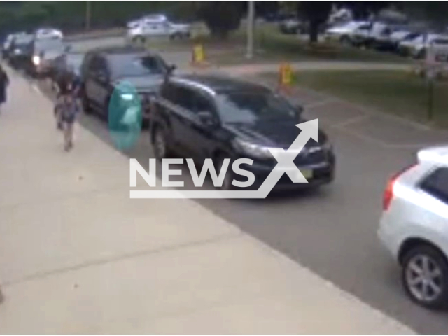 Photo shows police officer Mike Stallone and the kindergartner he rescued. He saved the child from getting pinned between two cars, at West Ridge Elementary in Park Ridge, Bergen County.
Note: Photo is a screenshot from a video(Park Ridge Police Department/Newsflash).