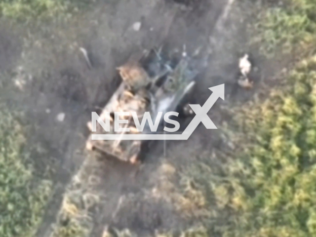 Picture shows destroyed Russian military vehicle and Russian soldiers crawling away in Ukraine in undated footage. The footage was released by the Poltava Separate Brigade of Ukrainian Territorial Defense Forces on Tuesday, June 20, 2023.  Note: Picture is a screenshot from a video (Poltava Separate Brigade/Newsflash)