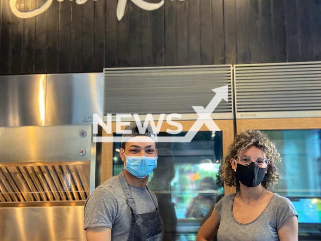 Pizza shop worker Yelfri Guzman, 23, (left) pictured with another worker, was shot at the restaurant, in Pescara, Italy on 10th April. Note: Private photo.  (@casarususti/Newsflash)