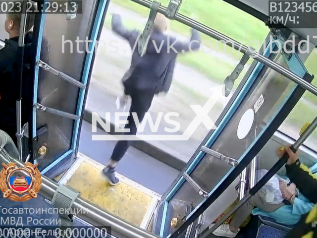 The passenger man jumps through opened doors of the bus at full speed in Arkhangelsk, Russian on Tuesday, June 13, 2023. The man was hospitalized. Note: Picture is a screenshot from a video (@gibdd708/Newsflash).