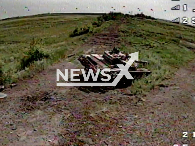 Ukrainian kamikaze drone destroys Russian tank on the frontlines in Ukraine in undated footage. The footage was released by 103rd Separate Territorial Defense Brigade on Monday, Jun. 26, 2023.
Notes: Photo is screen from a video. (@oborona.lviv/Newsflash)