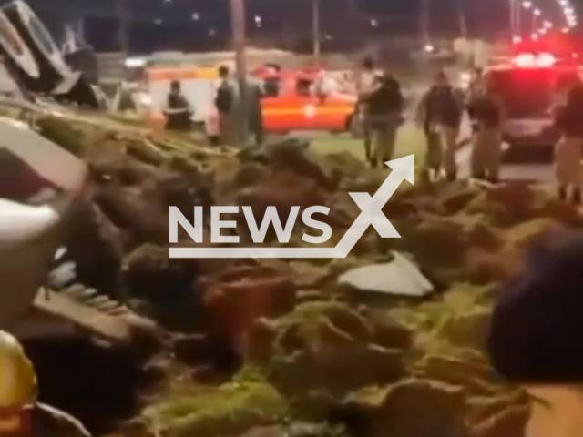 Picture shows  truck with more than 1 ton of pressed bars of  marijuana after it overturned on the road in Juiz de Fora, Brazil, on Sunday, June 25, 2023. The vehicle was being monitored by the military who blocked the road junction and the driver lost control when he saw the police.  Note: Picture is a screenshot from a video (@pmmg.oficial/Newsflash)