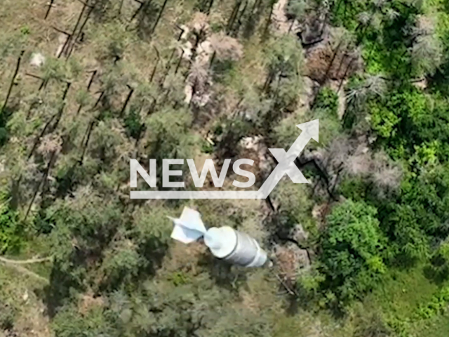 Ukrainian border guards drop bombs from drone at the Russian soldiers on the frontlines in Ukraine in undated footage. The footage was released by DPSU press service on Tuesday, Jun. 27, 2023.
Notes: Photo is screen from a video. (@DPSU-communication/Newsflash)