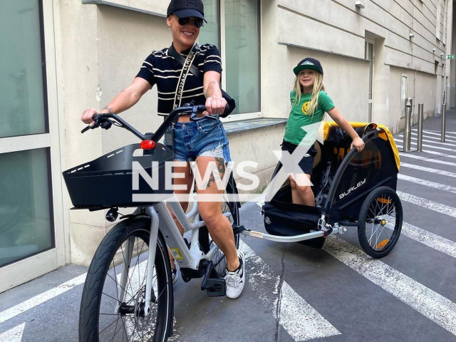 Pink poses with daughter in undated photo. Her daughter's bike was stolen. Note: Private photo. (@pink/Newsflash)