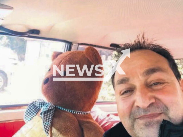 Metin Erdagi was pictured with the plush bear that his wife was jealous of for thinking it was a woman in Istanbul, Turkey. Note: Private picture (Newsflash)