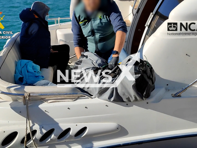 Officers working in the operation Eulalia and seizing the drug found in the boats in Malaga province, Spain.
Notes: Picture is from authorities (Newsflash)