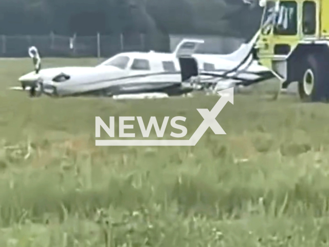 Photo shows a plane crash-landed by a passenger at Martha’s Vineyard Airport in Dukes County, Massachusetts, United States, Saturday, July 15, 2023. The male pilot, 80, was having a medical condition upon approach when the female passenger, 68, took over controls eventually landing the plane on its belly with no landing gear. Note: Picture is a screenshot from a video (Newsflash)