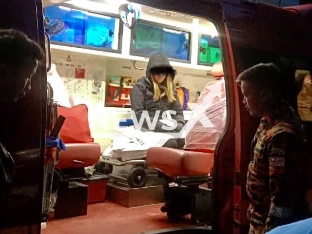 A 17-year-old girl from England sits  in an ambulance after she was   brought down by recue teams from Mount Kinabalu, Malaysia,  on Sunday, July 16, 2023.
She suffered from suspected hypothermia and acute mountain sickness. Note: Private photo. (Newsflash)