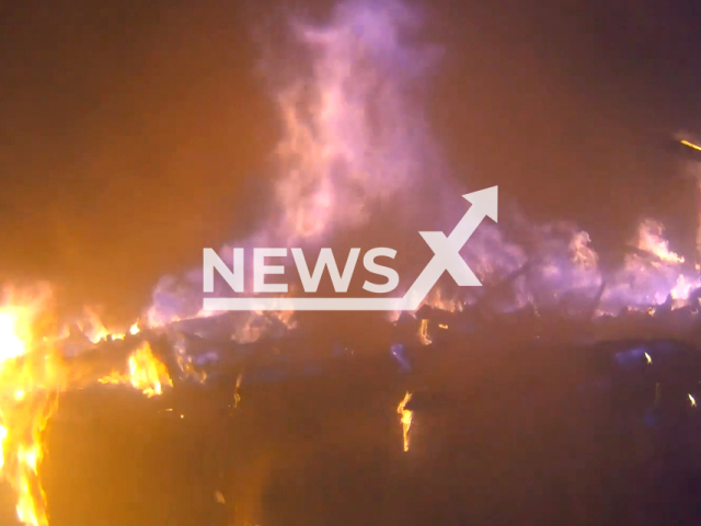 Bodycam video shows Citronelle Fire Rescue battling big blaze at Shadow Ridge Apartments in Citronelle, Alabama, United States 13 July , 2023. Note: Picture is a screenshot from a video (Citronelle Fire & Rescue/Clipzilla)