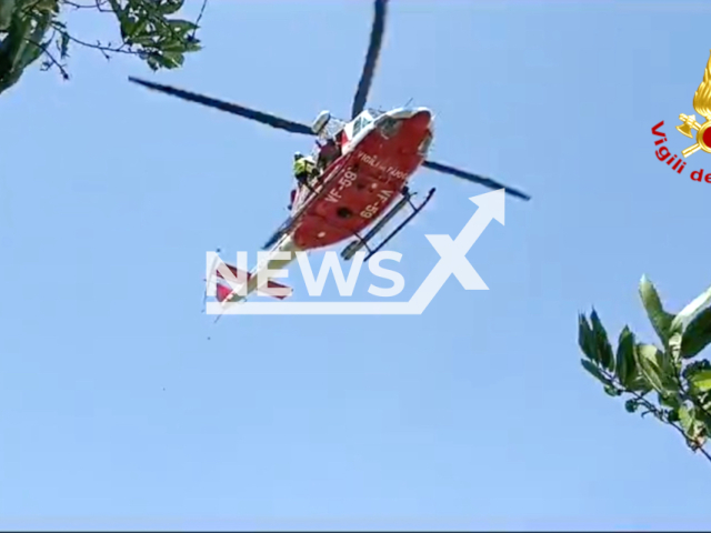 A photo shows a climber being rescued by The Italian Fire Brigade. He crashed into a cliff during work to make a rock wall safe in Campania, Nepal Italy on July 10, 2023. Note: This photo is from Italian Fire Brigade (Italian Fire Brigade/Clipzilla )