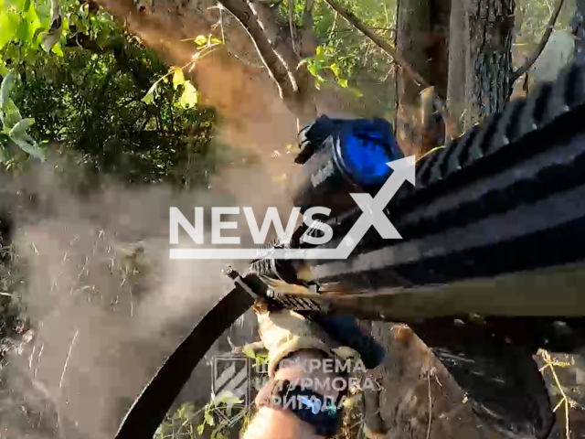 Ukrainian troops clear the Russian bunkers as they advance through the forests of the Donetsk region in Ukraine in undated footage. The footage was released by 3rd separate assault brigade on Wednesday, Jul. 19, 2023.
Notes: Photo is screen from a video. (@ab3army/Newsflash)