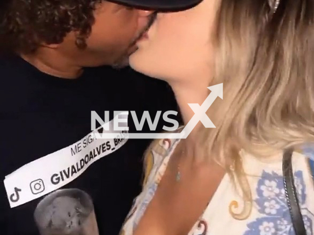 Givaldo Alves, 48, kissing influencer Grazi Mourao, 22, at a party in Rio de Janeiro, Brazil, on 3rd April. Note: This picture is a screenshot from the video (Newsflash).