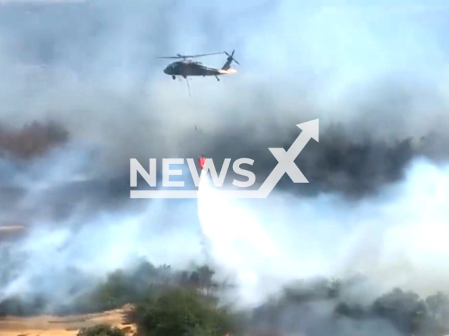 The Turkish Ministry of national defence deploys S-70 and AS-532 cougar helicopters to combat aggressive forest fires in Canakkale, Turkey on the 18th of July 2023. Note: This picture is a screenshot from the video. (Turkey Ministry of National Defense/Clipzilla)