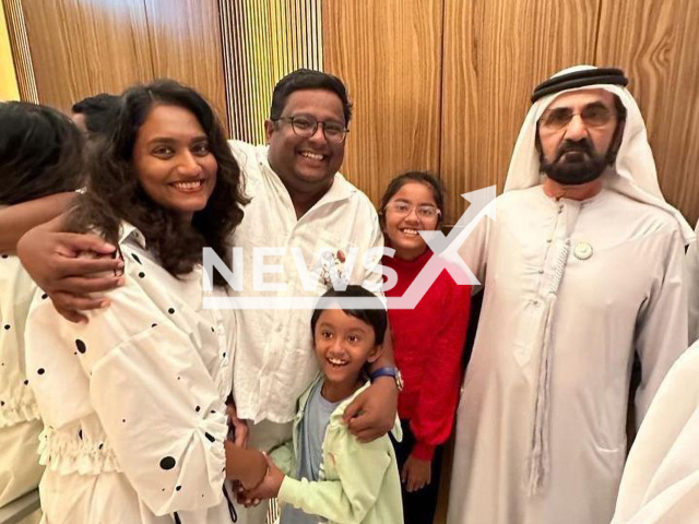 Dubai’s ruler Sheikh Mohammed bin Rashid Al Maktoum meets an Indian entrepreneur and his family in an elevator in Dubai, undated. The Sheikh allowed them to take photos with him and chatted with the daughter. Note: Licenced photo. (@a.r.junaid/Newsflash)