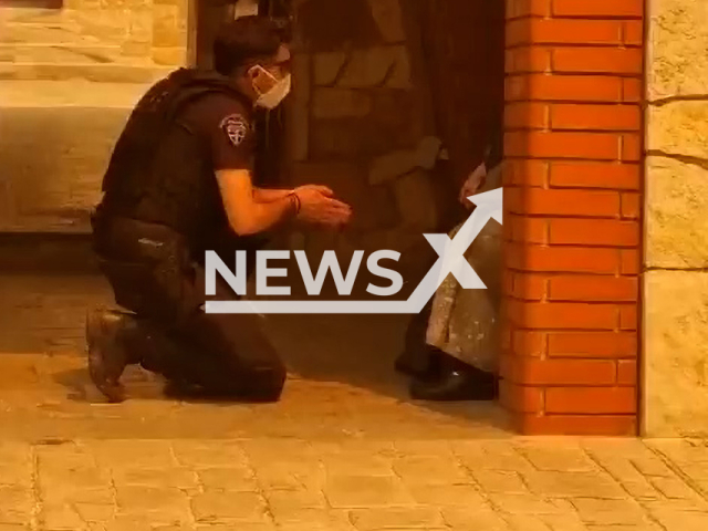 Police makes every effort to convince nuns to evacuate a convent in Mandra, Greece. Greece has asked other European countries for help to try to stop the fires that are raging in various regions.Note: Picture is a screenshot from a video (@hellenicpolice/Newsflash)