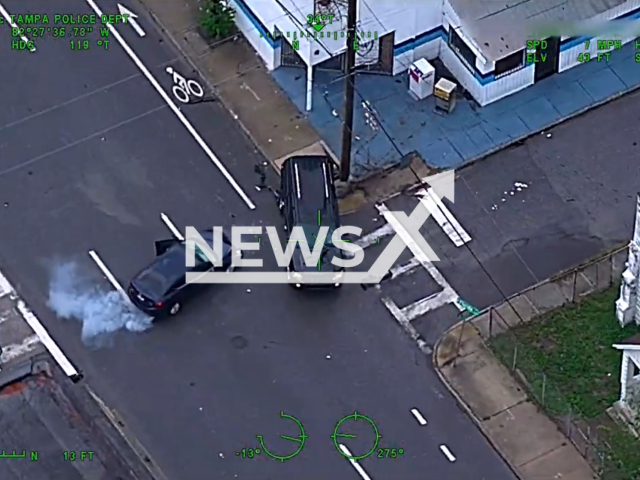 Footage shows the chase between police officers and an armed suspect in Tampa, Florida, Monday, July 17, 2023. The suspect was identified as Michael A Bresnahan and was killed during the officer-involved shooting. Note: This picture is a screenshot from the video. (TampaPD/Newsflash)