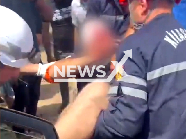 Picture shows the rescue operation of a man trapped in a car after a traffic accident in Khazar district in Baku, Azerbaijan on the 20th of July 2023. Note: This picture is a screenshot from the video. (Ministry of Emergency Situations of the Republic of Azerbaijan/Clipzilla)