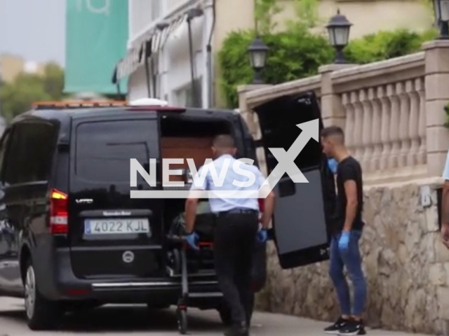 Photo shows the body of the Australian tourist while being taken out from the hotel in Cas Catala, Calvia, Mallorca. He fell from a third-floor balcony and died. Note: Photo is a screenshot from a video(Newsflash).