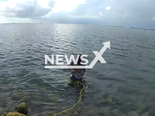 Deputies with Hillsborough County Sheriff's Office helped a murder suspect out of the waters where he attempted to escape into the ocean from the Sunshine Skyway Bridge in Hillsborough County, Florida United States on 19 July 2023. Note: This picture is a screenshot from the video. (Hillsborough County Sheriff's Office/Clipzilla)