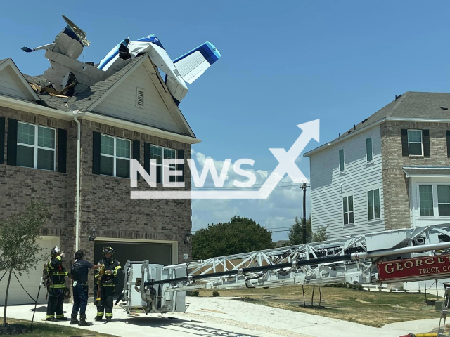 Photo shows the scene after a small plane carrying three people crashed into the roof of a home in Texas, USA, Sunday, July 23, 2023. all three passengers only suffered minor injuries and were released from the hospital. Note: Licensed photo (Georgetown Texas Fire Department/Newsflash)