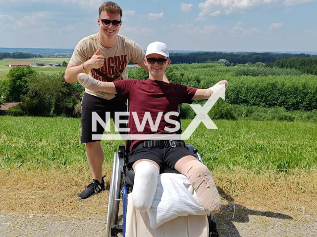 Fabian, 14, and his brother Danny, 22, pose in undated photo. The 14-year-old boy from the city of Moenchengladbach, Germany, lost both his arms and legs after catching a cold on Thursday, March 30, 2023. Note: Private photo. (Newsflash)