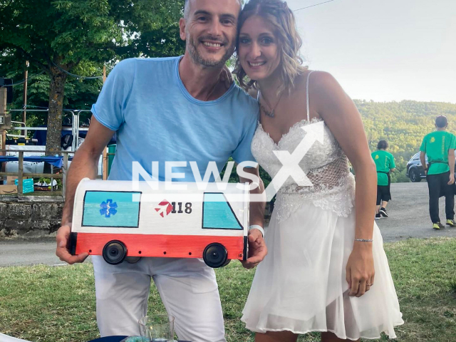 Andrea Soriano and Sara Pattarozzi pose in undated photo. They saved a wedding guest who suffered a cardiac arrest in Montorso, Modena in Italy. Note: Private photo. (Sara Pattarozzi/Newsflash)