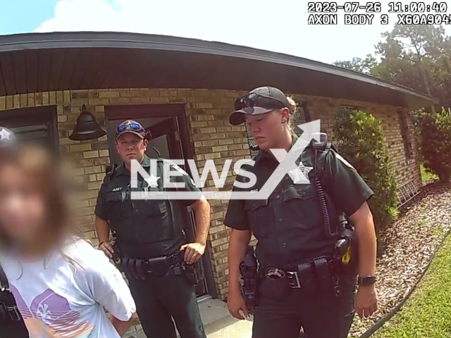 Photo shows the moment 11-year old Florida girl was arrested on Wednesday, July 26, 2023. The girl falsely reported that her friend was kidnaped by an armed man. Note: Photo is a screenshot from a video. (Volusia Sheriff's Office/Newsflash)