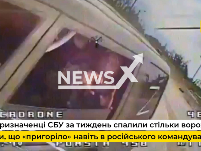 Ukrainian kamikaze drone hits Russian military vehicle driving soldiers in Ukraine in undated footage. The footage was released by the Security Service of Ukraine on Saturday, Jul. 29, 2023. Notes: Photo is screen from a video. (@SBUkr/Newsflash)