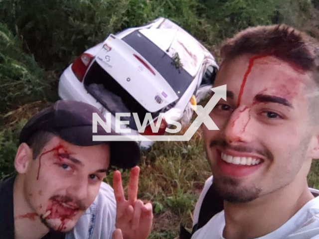 Nickolas Tonet, 19, (right) and Lucas Gelain, 20, (left) took a selfie after being in a car accident, in Rio Grande do Sul, Brazil, in January, 2022. Note: Private photo.  (@NicolasTonet1/Newsflash)