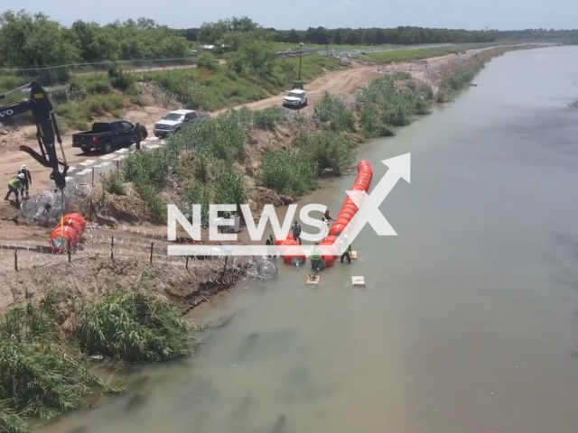 Photo shows the installation of the floating barrier. Texas authorities have installed it in the section of the Rio Grande. Note: Picture is a screenshot from a video (@LtChrisOlivarez/Newsflash)