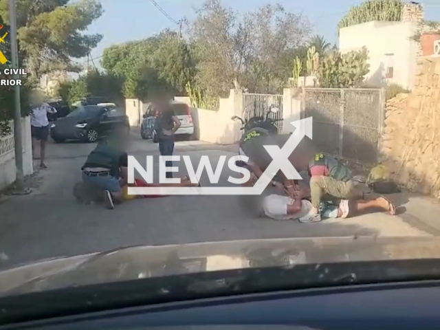 Moment of the operation that ended up with the three most wanted European fugitives in Calpe, in the eastern Spanish province of Alicante, Valencia region. They were on holidays. Note: This picture is a screenshot from the video. (Newsflash)