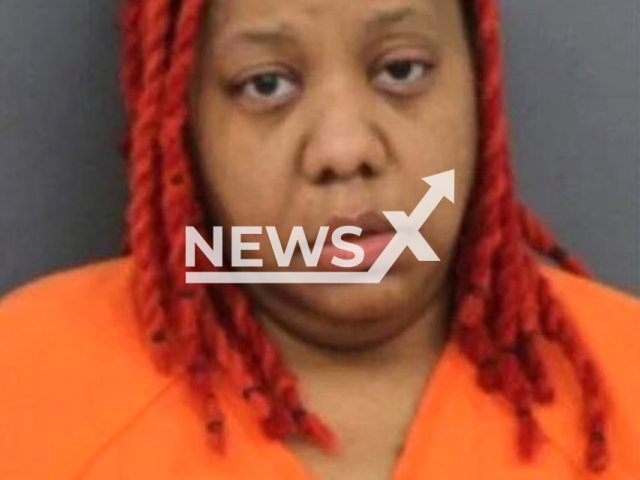 Sushi Staples poses in undated photo. She is charged with obstructing justice, failure to report the death of a child under 13, and concealment of death in Rock Island, Ill. Note: Police photo. (Rock Island County Jail/Newsflash)