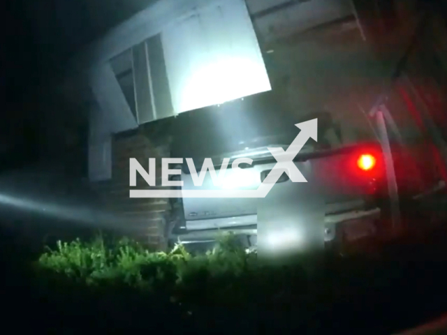 Body cam footage shows the moments officers rescue a man who was trapped after a truck crashed into a home in Dayton, Ohio, United States on 3 August 2023. Note: This picture is a screenshot from the video. (Dayton Police & Fire/Clipzilla)