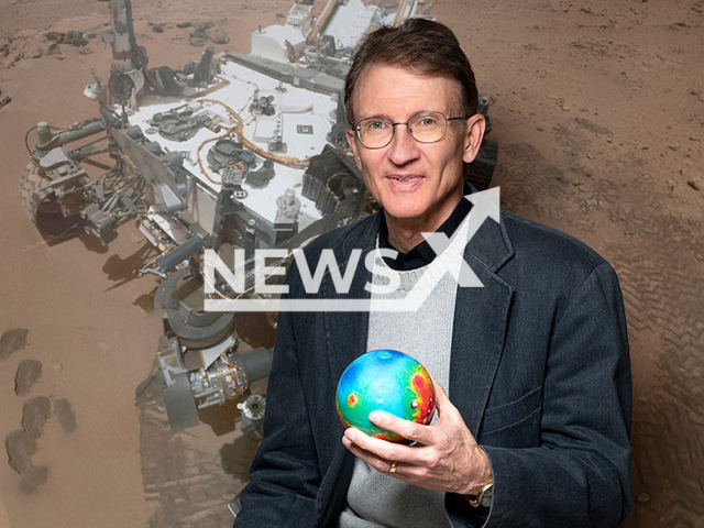 Roger Wiens, a planetary scientist and Mars rover expert at Purdue University with a topographical model of Mars and a photo of Curiosity.

Note: Photo from press statment . (Purdue University-John Underwood/Newsflash)