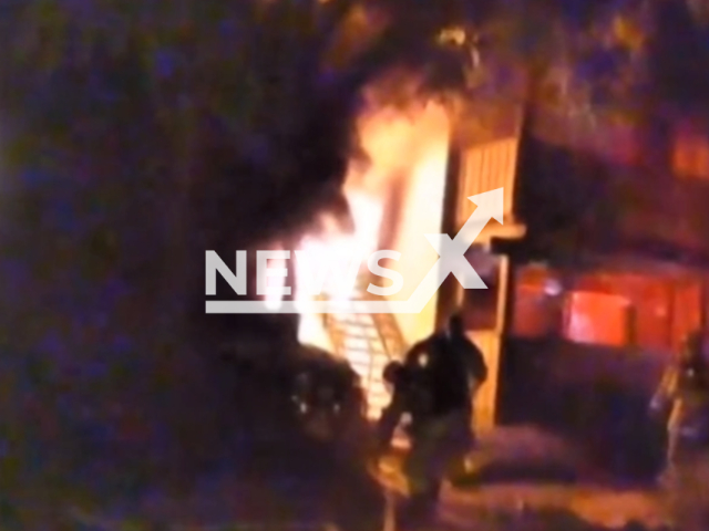 Officers responded to a structure fire and began evacuating neighbouring apartments that were being damaged by the flames at Country Hills Apartments in Brea, northern Orange County, California, United States on 1 August 2023. Note: This picture is a screenshot from the video. (Brea Police Dept/Clipzilla)