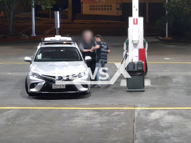 Man steals car at Fairfield, Brisbane, Australia, Friday, Aug. 4, 2023. A taxi driver was refuelling his cab when he was threatened. Note: This picture is a screenshot from the video. (South Brisbane Police/Clipzilla)