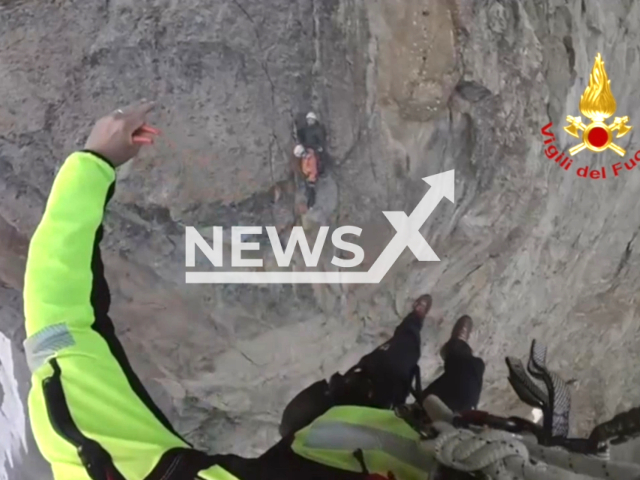 Fire Brigade rescued two climbers who were stuck on the wall at an altitude of 3000 meters,, in the mountains of Locana near Turin Italy, on the 7th of August 2023. Note: This picture is a screenshot from the video. (National Fire Brigade Italy/Clipzilla)