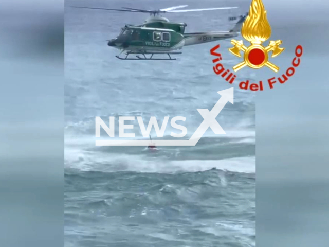 Two bathers were rescued by the Flight Department the request had come for a swimmer in difficulty, attached to a red buoy, about 80 meters from the Capolungo shore near Genoa, Italy on 3 August 2023. Note: Picture is screenshot from a video. (National Fire Brigade Italy/Clipzilla)