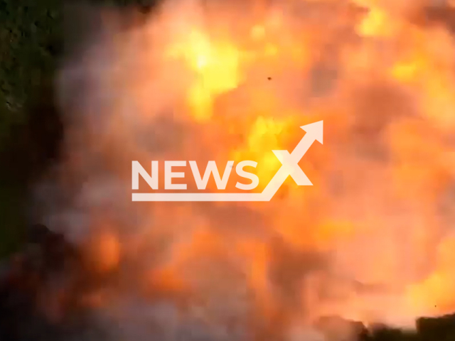 Huge explosion as Ukrainian drones drop bombs at the Russian military target on the battlefield in Ukraine in undated footage. The footage was released by 56th separate motorized infantry Mariupol brigade on Sunday, Aug. 6, 2023.
Notes: Photo is screen from a video. (56th separate motorized infantry Mariupol brigade/Newsflash)